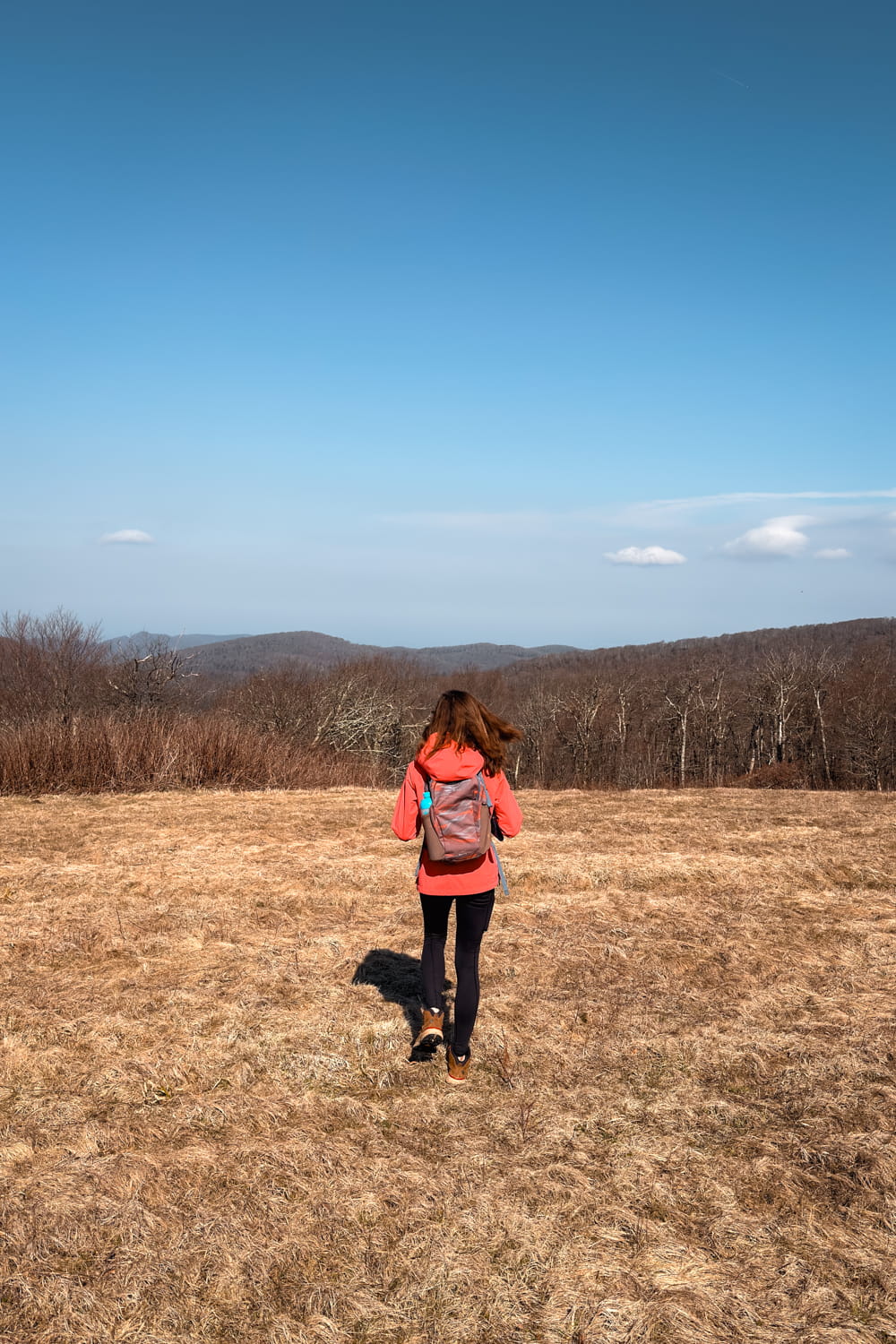 girl hiking on hooper bald in the winter