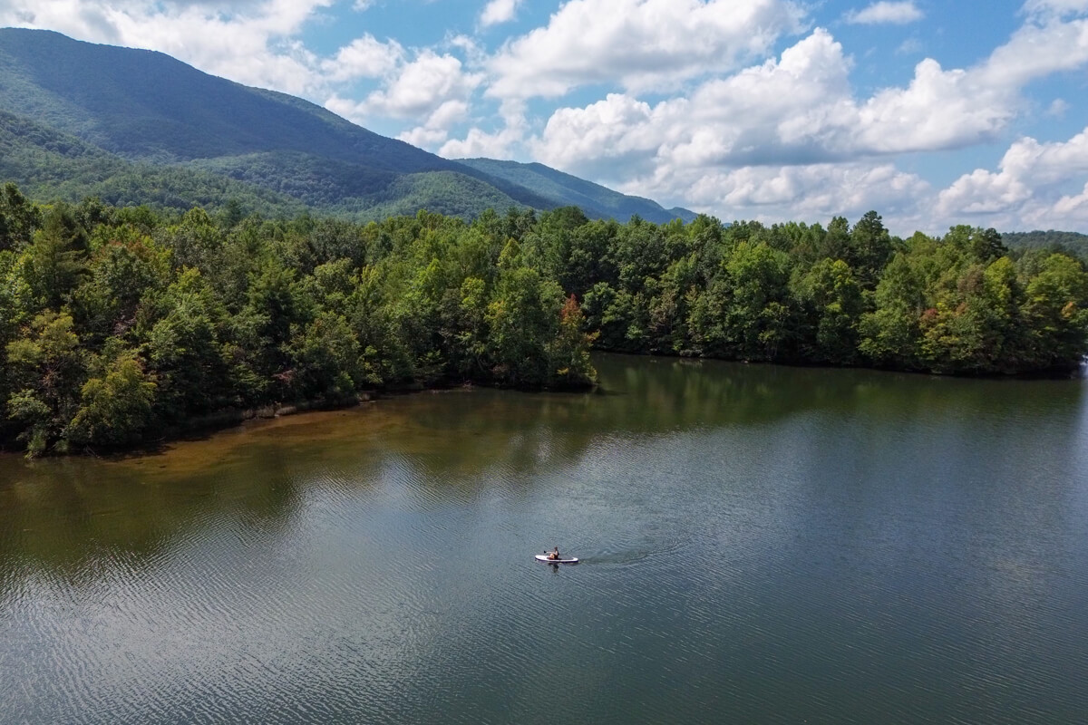 girl on an SUP paddling indian boundary lake in tennessee